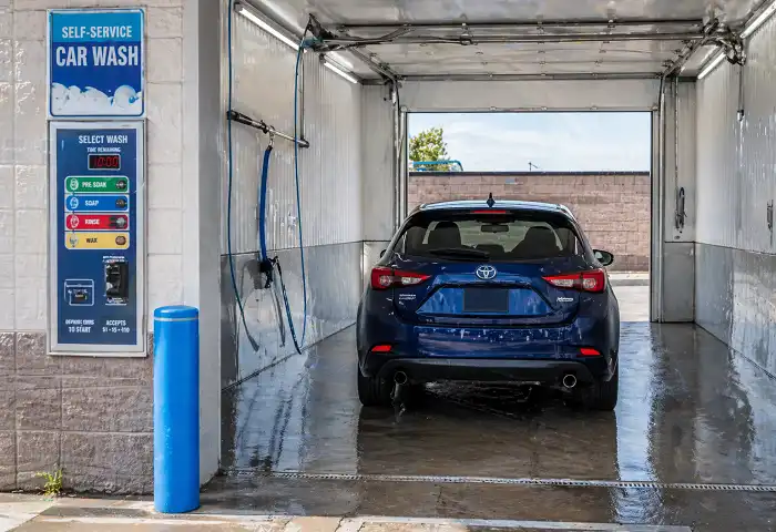 Coin operated self service car wash bay exterior