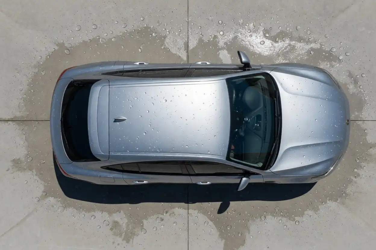 Clean silver SUV after a touch free car wash viewed from above