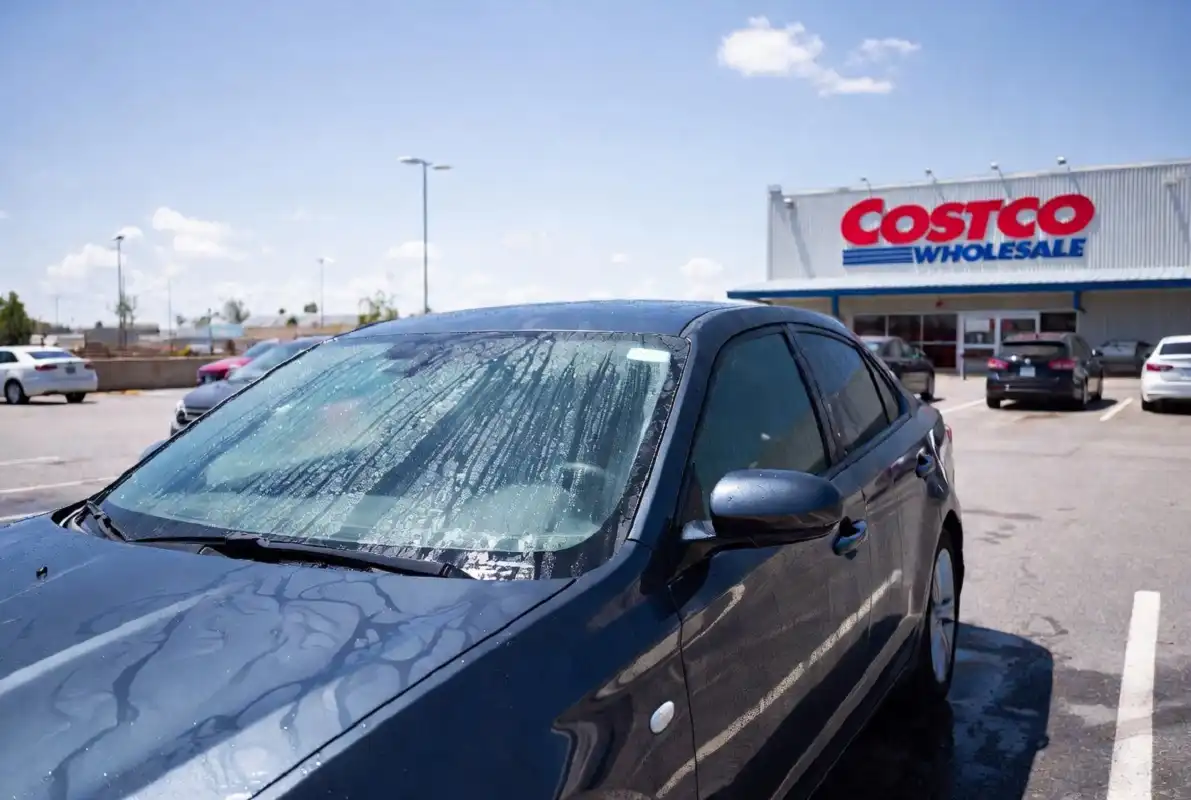 Clean shiny vehicle parked outside a Costco store after a car wash