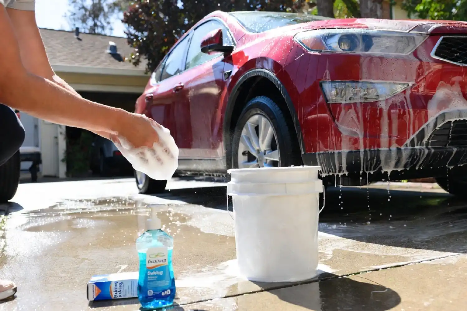 Home make car wash soap at home using dish soap and water in a bucket