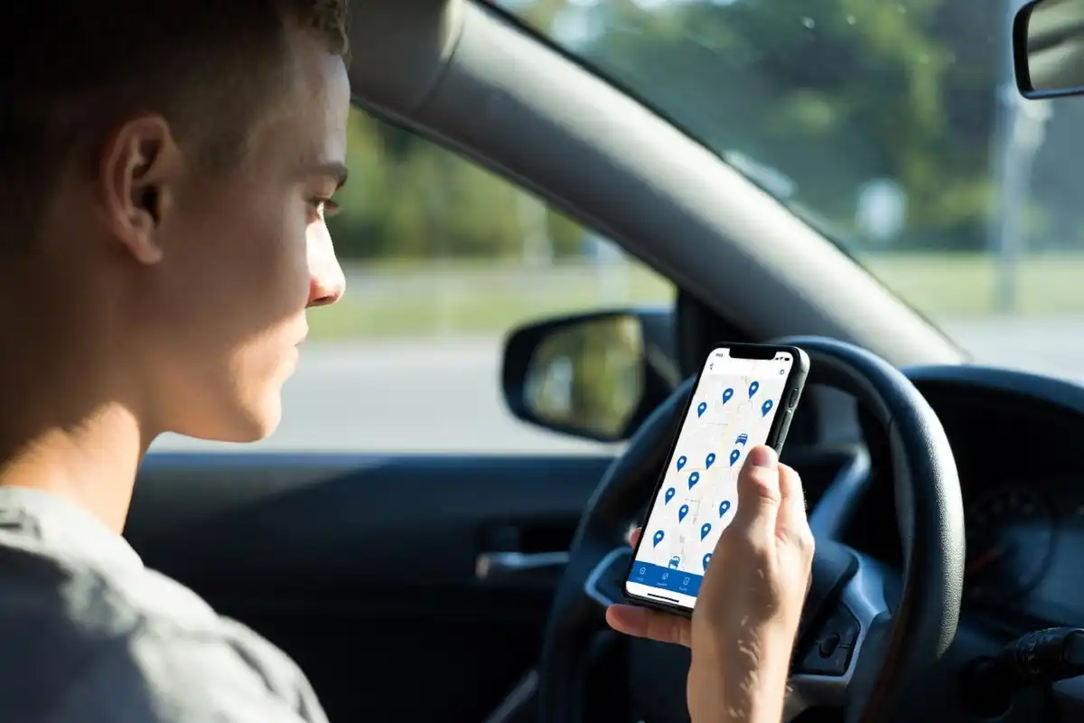 Person searching for nearest car wash on smartphone