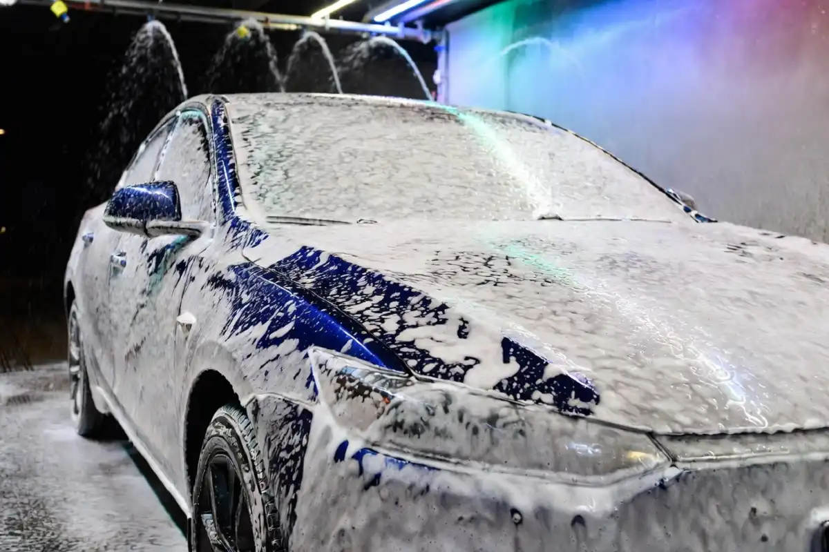 Car going through foam wash treatment at Shiny Shell Car Wash