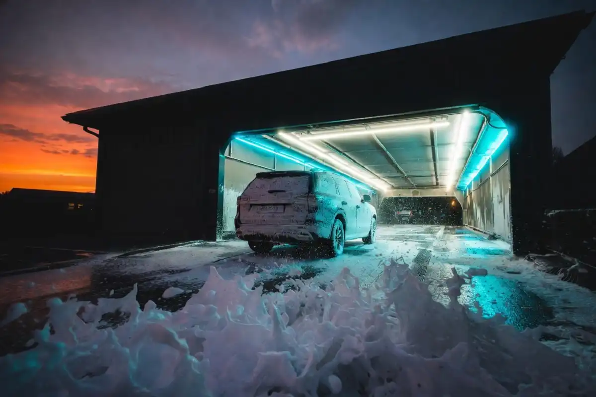 Splash car wash tunnel entrance with foam and water jets