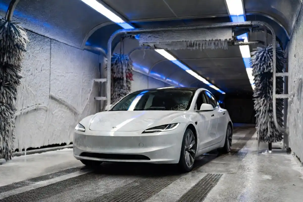 Tesla Model 3 entering an automatic tunnel car wash