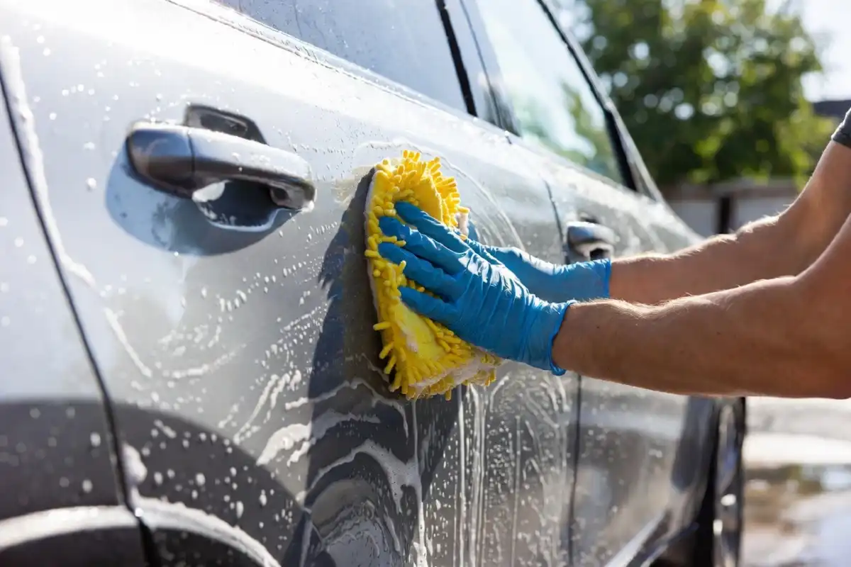Crystal clear car windshield with no streaks after applying homemade vinegar glass cleaner spray
