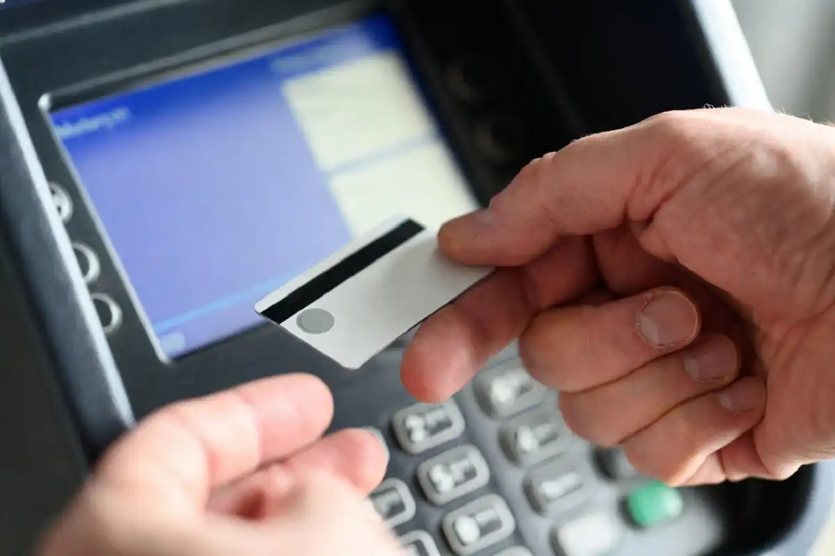Driver scanning a Whitewater Express Car Wash membership tag